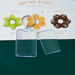 Transparent acrylic blank keychain photo frame with metal lock ring for custom gifts.