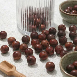 Natural Burmese rosewood loose beads for DIY bracelets and prayer beads. High quality detail view.