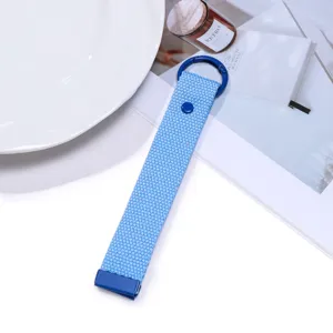 Detailed close-up shot of blue woven keychain lanyard with solid metal ring hardware.