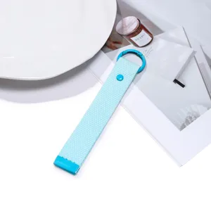 Light blue woven lanyard keychain with round ring and snap button, simple versatile bag pendant.