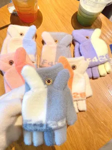 Cute winter convertible fingerless gloves for women, warm knit flip top touch screen mittens.