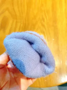 Detail shot of winter warm plush fleece glove interior, featuring thick soft material.