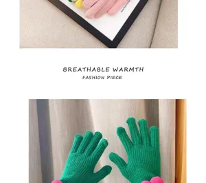 Winter green knit gloves detailed view, warm five-finger design with cute pink flower cuffs.