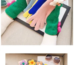 Women winter knit fingerless gloves with cute 3d flower decoration, cozy warm hand wear detail.