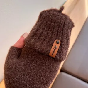 Brown knitted convertible half-finger winter gloves with plush texture and cozy leather label.