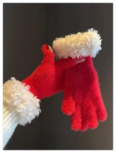 Close-up detail shot of winter plush half-finger gloves in vibrant red with white furry cuffs.