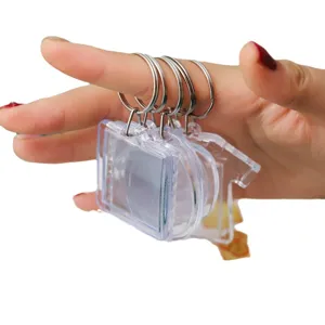 Clear acrylic blank photo frame keychain set with metal rings, ideal for custom gifts.