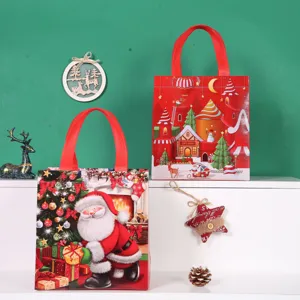 Christmas non-woven gift bags with festive Santa Claus and castle design for holiday packing.