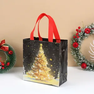 Thickened Christmas non-woven tote bag with golden tree print, perfect for holiday gift packaging.