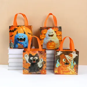Halloween non-woven gift bags with cute cartoon monster designs, ideal candy tote bags.