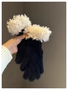 Detailed close-up view of winter plush gloves featuring cozy fuzzy white cuffs and soft fabric.