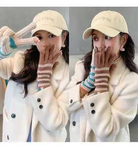Detailed view of women winter knitted striped fingerless touch screen warm gloves, Korean style.