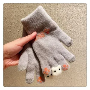 Cute knit winter gloves featuring adorable bear design and convenient touch screen fingertips.