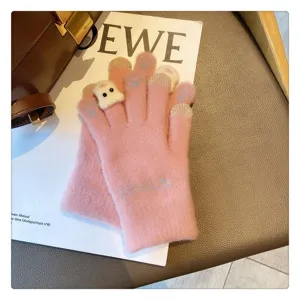 Cute knit winter gloves for women with touch screen fingers and warm plush bear design.