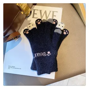 Detail view of winter warm knit gloves featuring cute cat paw designs and soft touch screen.