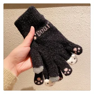 Cute winter knit gloves for women with bear paw design, warm fleece-lined touch screen detail.