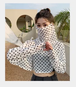 Polka dot sun protection shawl and sleeve detail view, breathable outdoor uv block accessory.