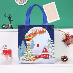 Christmas gift bag non-woven tote bag with Santa Claus and snow scene design for holiday packaging.