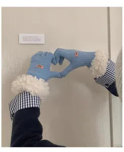 Blue knit gloves for women with fluffy plush cuffs and cozy winter thermal design detail.