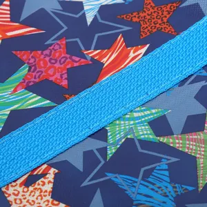 Durable non-woven storage bag fabric detail with colorful star pattern and strong handle.