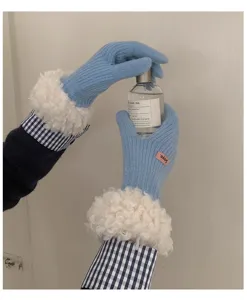 Stylish women's winter warm knit gloves featuring fluffy fleece cuffs and pink label.
