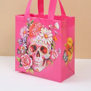 Pink sugar skull non-woven gift bag with colorful floral print, perfect for Halloween party.