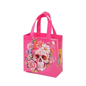 Detailed view of pink non-woven shopping gift bag with vibrant floral sugar skull print.