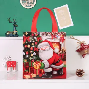 Christmas non-woven gift bag with cute Santa Claus pattern for holiday present packaging.