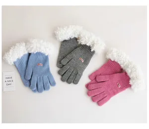 Knitted gloves detail showing plush cuffs and soft wool fabric in three cozy colors.