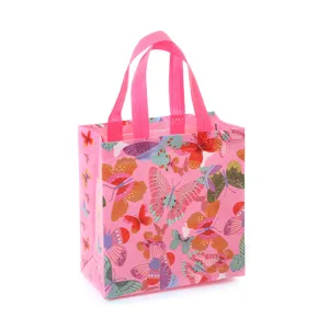Pink non-woven gift bag with colorful butterfly print, stylish shopping handbag for parties.