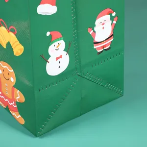 Green non-woven Christmas gift bag detail featuring cute Santa and snowman prints for holidays.