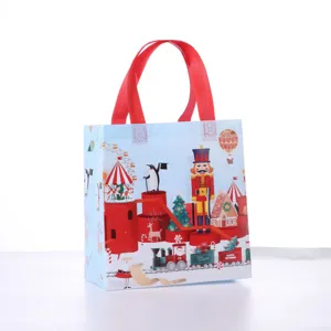 Christmas non-woven gift bag with festive Santa and nutcracker design for holiday gift packaging.
