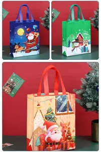 Festive Christmas non-woven gift tote bag with cute cartoon Santa and snowman holiday designs.