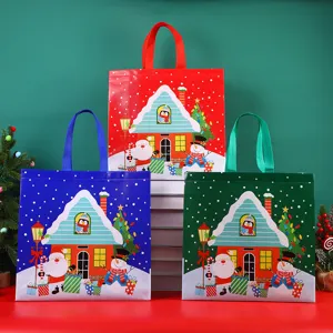 Christmas non-woven gift bags with cute snowman and Santa Claus designs for holiday shopping.