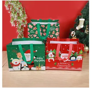 Christmas non-woven gift bags set, cute Santa and snowman cartoon tote bags for holiday packaging.
