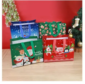 Detailed view of cute Christmas non-woven gift bags featuring Santa and snowman designs.