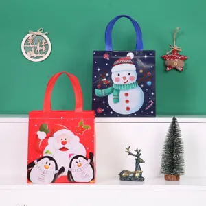 Christmas non-woven gift bags with cute snowman and Santa Claus designs, perfect for holiday wrapping.