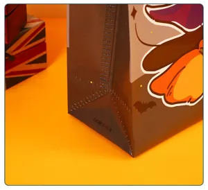 Halloween candy bag detail showing the bottom fold texture and non-woven fabric material clearly.
