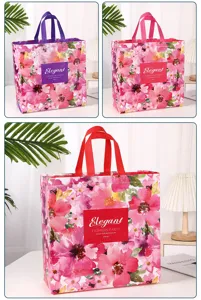 Detailed view of waterproof floral non-woven tote bag with colorful handles and elegant print.