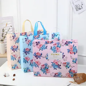 Large floral non-woven waterproof tote bag for bedding storage, fashion portable clothing gift packaging.