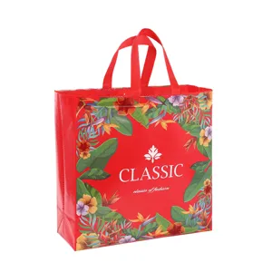 Red laminated non-woven shopping tote bag with tropical leaf pattern, waterproof gift packaging.