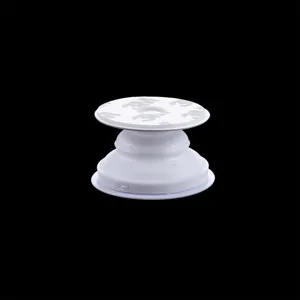 Witte inklapbare telefoonhouder grip met 3M lijm achterkant voor veilige mobiele grip.