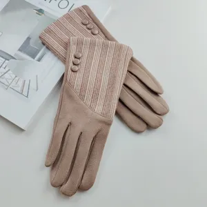 Detail view of women's warm faux suede gloves with stylish striped cuffs and decorative buttons.