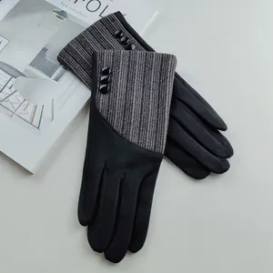 Women's chic suede and knit contrast winter gloves with stylish button details detail shot.