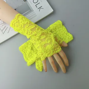 Fluorescent yellow lace fingerless gloves detail shot, hollow out design, stretch mesh.