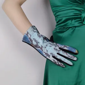 Detailed view of women snake pattern touch screen warm fleece lined cycling gloves closeup.