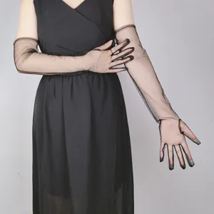 Black sheer long mesh gloves detail shot, elegant evening dress accessory fashion wear.