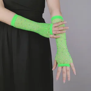 Close-up view of neon green fishnet fingerless gloves sparkling with rhinestones details.