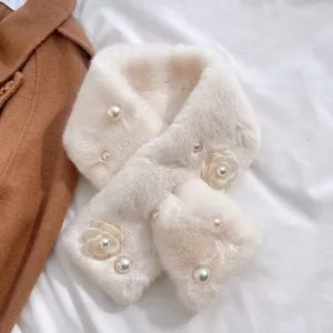 Close-up of fluffy faux rabbit fur scarf detail, elegant pearl and flower decoration.