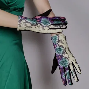 Detail view of women fashion colorful snakeskin print touchscreen warm gloves for winter wear.